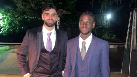 Karim Akhtar Karim Akhtar and Sully Laurent wearing suits