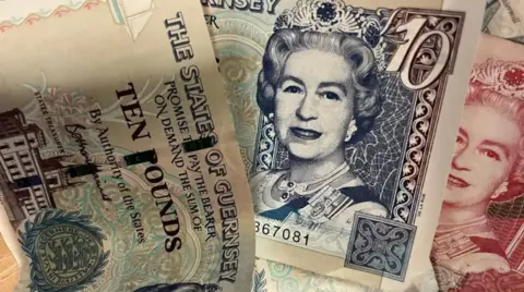 BBC Picture shows Guernsey bank notes featuring the late Queen Elizabeth II