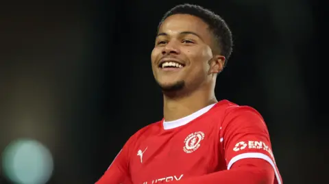 A smiling Adrien Thibaut in action for Crewe Alexandra