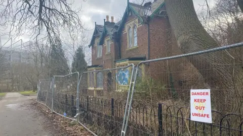 The Western Lodge taken from the side. St James' Park can be seen in the background.