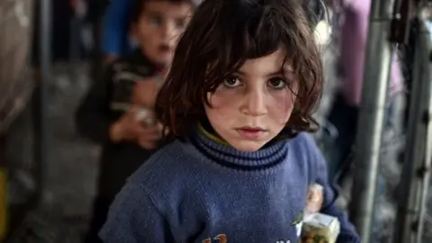 AFP/ Getty Images Child refugee