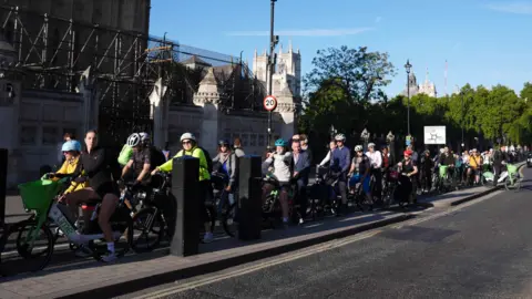 PA Media Cyclists on Bridge Street, Westminster at 8am the Embankment.

