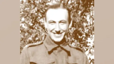 Allard family A sepia-toned black and white image of Tom Allard. He has short hair and is wearing a British Army tunic. He is smiling broadly.