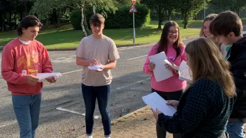 Students collect their grades at Ysgol Bro Myrddin in Carmarthen