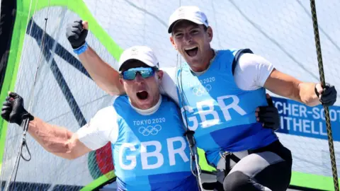 Getty Images Stuart Bithell and Dylan Fletcher-Scott winning gold at Tokyo Olympics