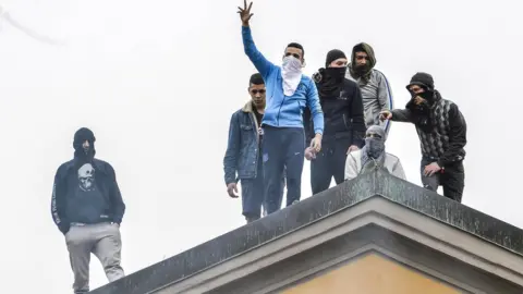 EPA Detainees protest on the roof of the San Vittore prison in Milan, northern Italy, 9 March 2020