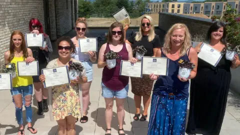 Women's Work Lab Kelly, far right, graduating from the Women's Work Lab programme