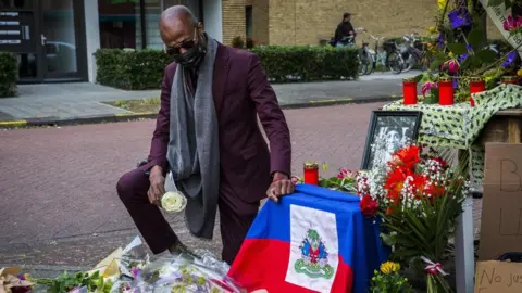 Getty Images Mondy Holten, brother of Tomy Holten, pays tribute to his brother in Zwolle in June 2020