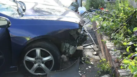 Avon and Somerset Police The blue Honda which was used to attack K Dogg