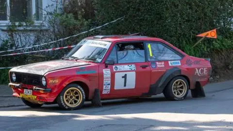 A red car, bearing the number one, was this year's winner.