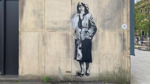 A stenciled mural of Andrea Dunbar in Bradford city centre 