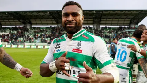 Onisi Ratave celebrates after Benetton's win against Ospreys