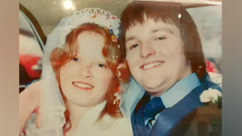 Family handout Sean and Susan O'Gorman smile lovingly at the camera on their wedding day.