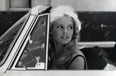 Keystone Press/Alamy Bardot in a new car that she just received while filming the 1959 movie, Voulez-vous danser avec moi? (Do you want to dance with me?) 