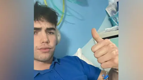 Supplied Charlie in hospital wearing a blue t-shirt undergoing treatment