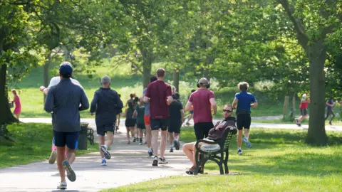 People running in a park