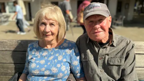 Emma Baugh/BBC Maggie and Ollie smiling for the camera 