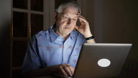 Getty Images Man at a computer (stock image)