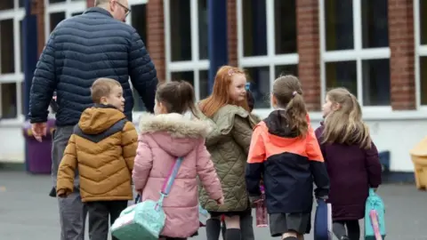Pacemaker Children arriving back to school at Braniel Primary school in Belfast