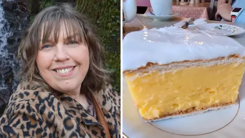 Two photos side by side. On the left is Dawn Fearn, a woman in her 50s. She has shoulder length brown hair and a fringe and smiles at the camera. She is wearing a leopard print coat. On the right is a large custard slice pastry on a plate.