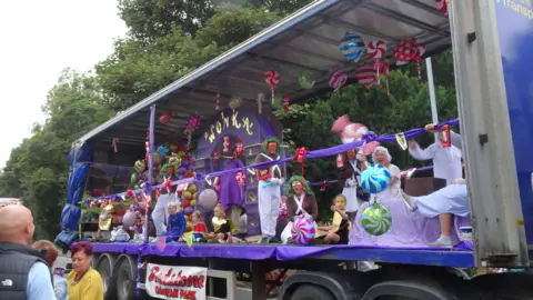 Laura Minor An open lorry has been decorated to resemble characters from Charlie and the Chocolate factory