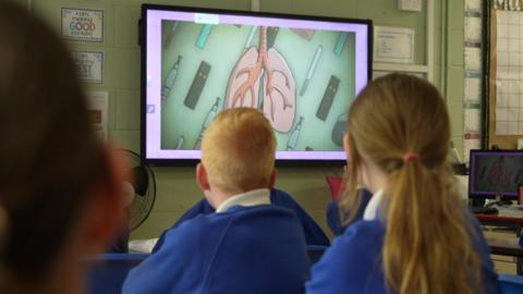Children at Reevy Hill Primary School watching a video on the potential impacts of vaping on children's health