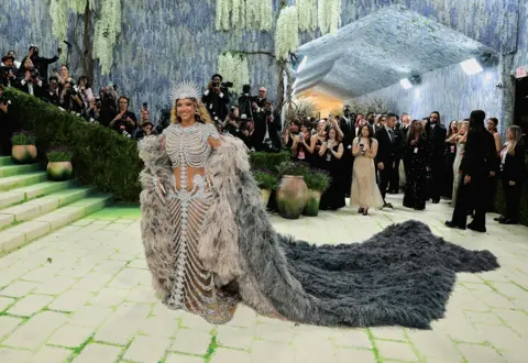 Reuters Beyonce wears a gown with an embellished skeleton design, and a giant feather cape for the benefit of the Metropolitan Museum of Art's Costume Institute with this year's theme 'Costume Art' in New York City, New York, U.S., May 4, 2026. R