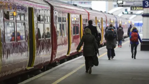 Getty Images Train on platform with departure passengers