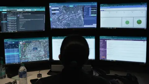 BBC A ShotSpotter analyst at a workstation
