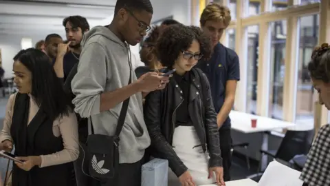 Getty Images Students receiving A-level results