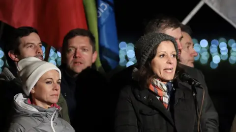 EPA Independent Member of Parliament Bernadett Szel (R) delivers her speech during the rally held against the government in front of the headquarters of the public broadcaster MTVA in Budapest, Hungary, 17 December 2018