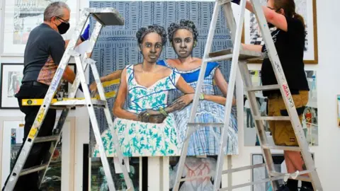 Alice Hendy Painting being hung ready for the 168th annual open exhibition