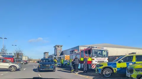 Tracie Bestford Police cars and fire trucks are parked across a number of disabled parking bays outside the Teesbay Shopping Centre.