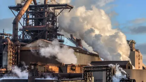 Getty Images Steelworks with smoke and steam