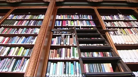 BBC Shot from below of library shelves