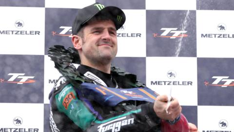 Michael Dunlop sprays the champagne