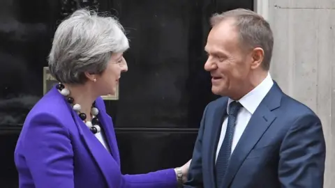 PA Theresa May and Donald Tusk