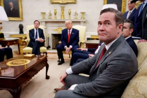 National security adviser Michael Waltz in the Oval Office with President Trump.