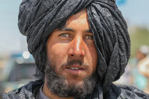 EPA A Taliban fighter poses for a photograph in Kabul, Afghanistan, 16 August 2021