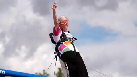 Betty Bromage, 97, on the wing of an Aero-Super-Batics biplane during an attempt to break the Guinness World Record for the oldest female wing-walker, with her sixth wing walk, at RFC Rendcomb Airfield near Cirencester, Gloucestershire. 