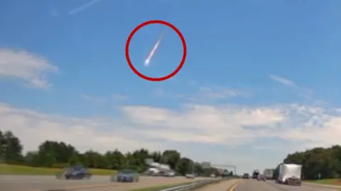 A fireball is seen in the sky.