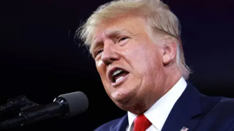 Getty Images Former President Donald Trump speaks during the Conservative Political Action Conference on 26 February in Florida