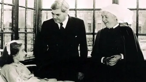 Trafford Healthcare NHS Trust/PA Aneurin Bevan on a hospital visit on the day the NHS was founded in July 1948