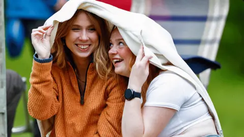 Getty Images Sheltering from rain