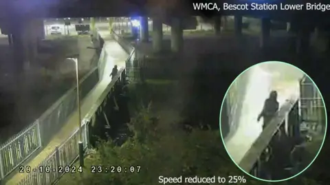 CPS Colour CCTV footage which was shown in court. A person can be seen on a bridge.