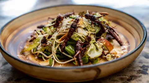 Getty Images A crockery   topped with crickets