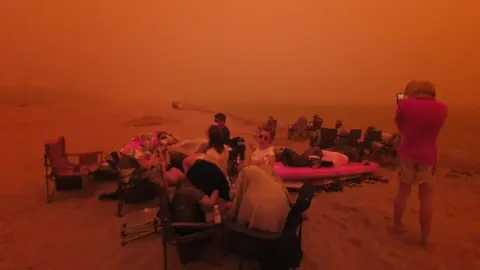 ALASTAIR PRIOR Locals evacuated to the beach at Bateman's Bay in New South Wales