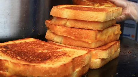 The Great American Grilled Cheese Kitchen Grilled cheese sandwiches on a griddle
