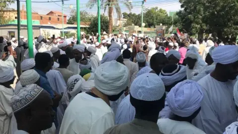 Mohamed N Elmahdi People leave the Sayed Abdelrahman mosque in eastern Omdurman, in the neighbourhood of Wad Nubawi.