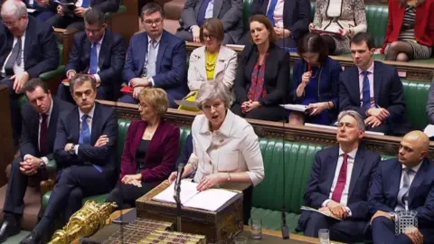 AFP/Getty Images Theresa May making a statement to the House of Commons